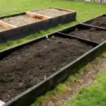 A beautiful Lasagna Gardening setup with layered organic materials and thriving vegetable plants.